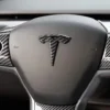 Tesla emblem ratt