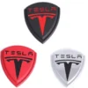 Tesla emblem olika färger