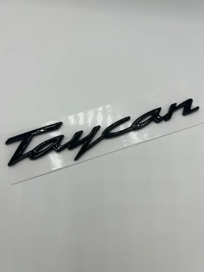 Porsche Taycan emblem blanksvart